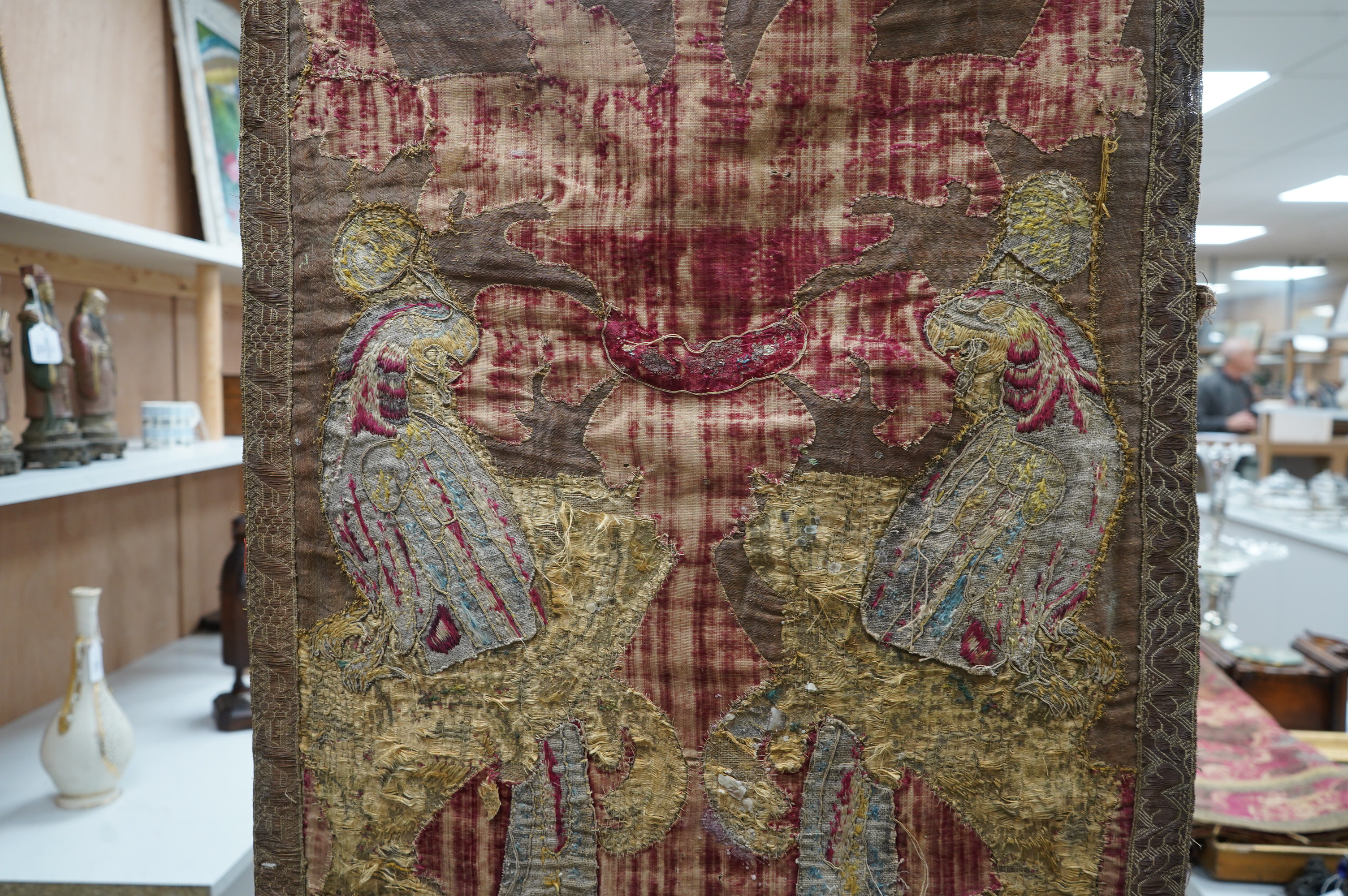 A fine Italian Renaissance style velvet, embroidered and appliqué wall hanging, originally part of a pilaster hanging, made with crimson silk velvet, gold appliqué and colourful polychrome silk embroideries of parrots an